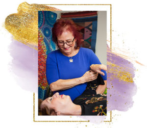 Roberta Millard providing healing touch therapy